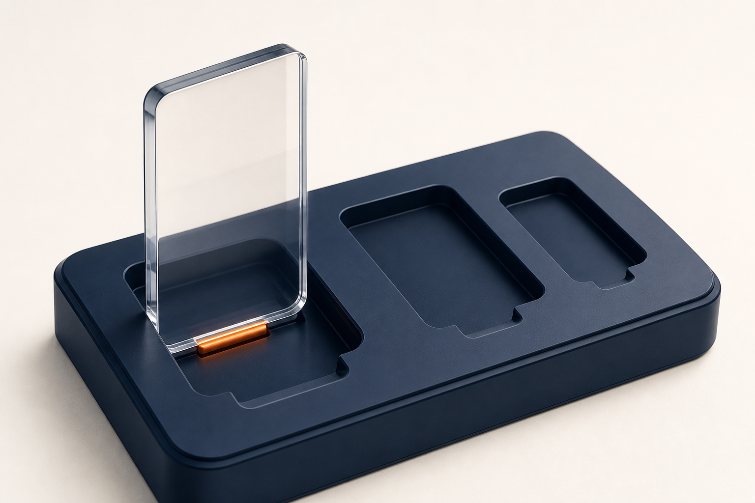 A glass cartridge rests in a navy cradle with three differently sized docking bays and one orange contact point.
